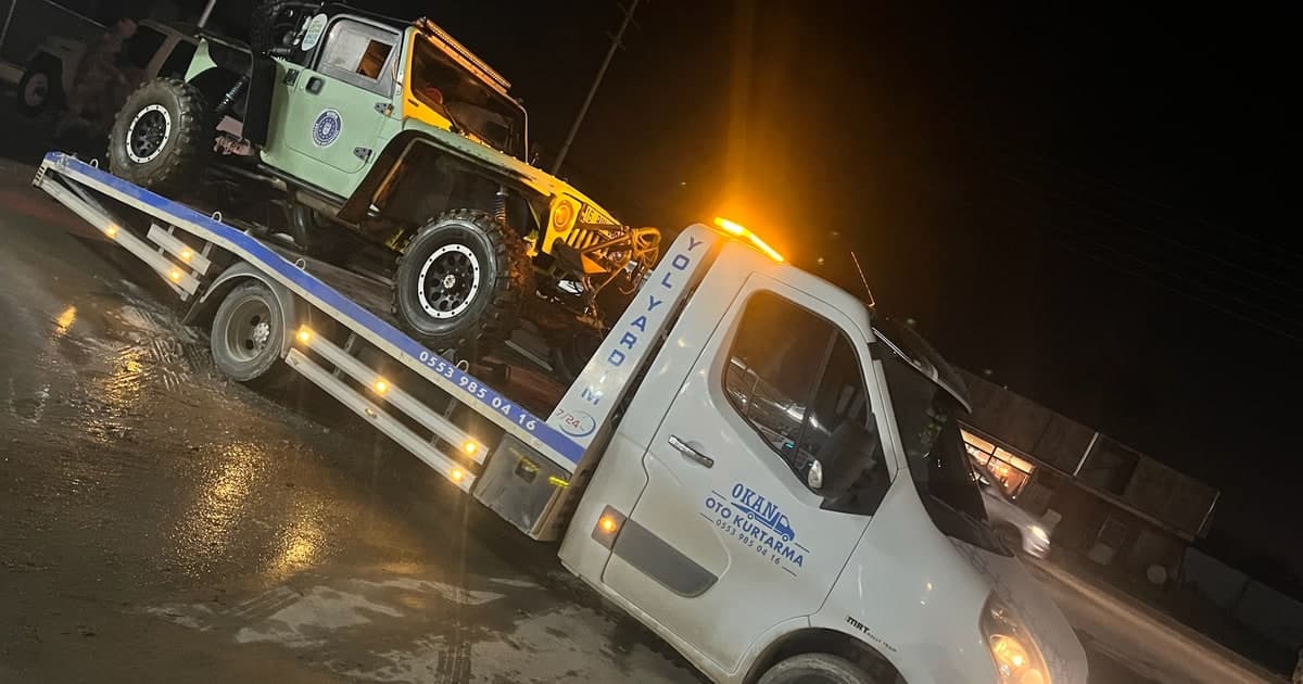 Night off-road vehicle tow on wet ground in winter conditions